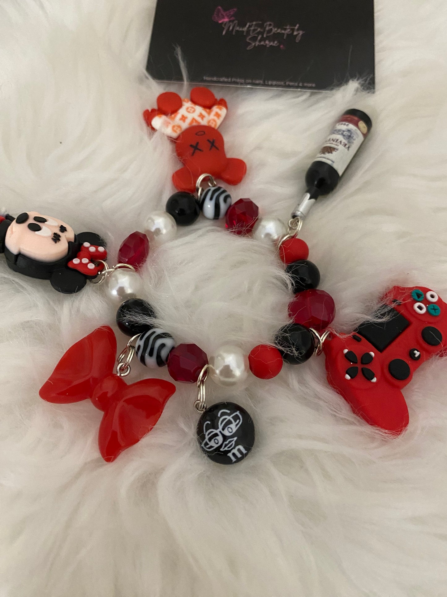 Red/black/white bracelet w charms