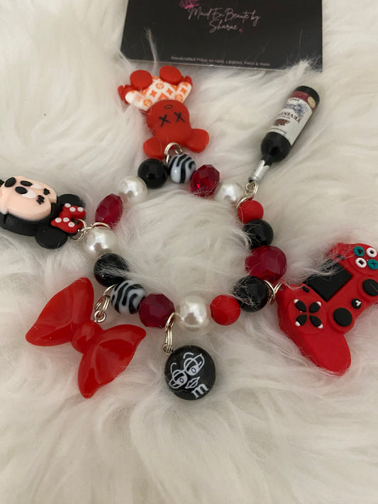 Red/black/white bracelet w charms