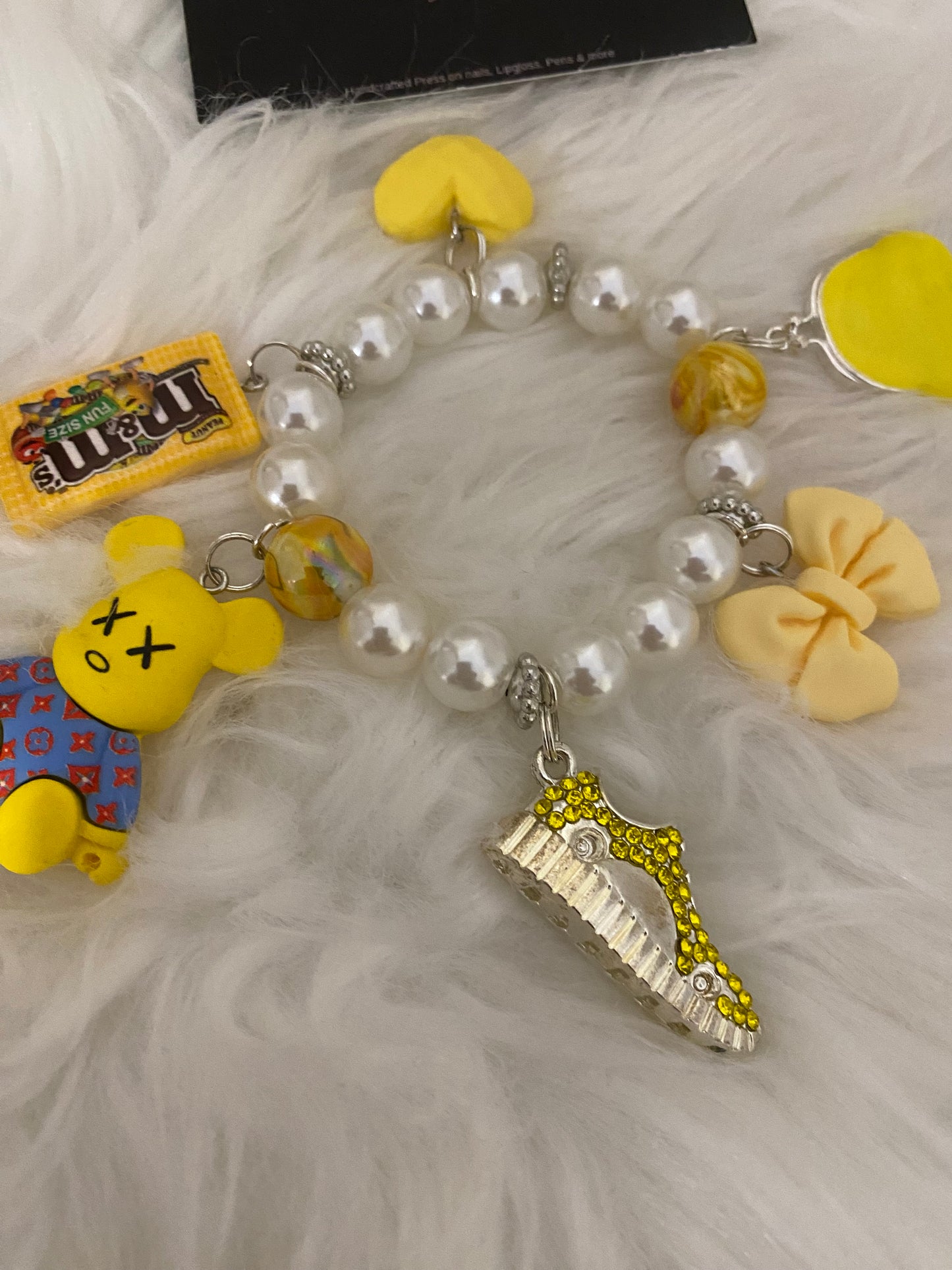 Yellow/white bracelet w charms
