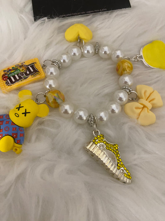 Yellow/white bracelet w charms